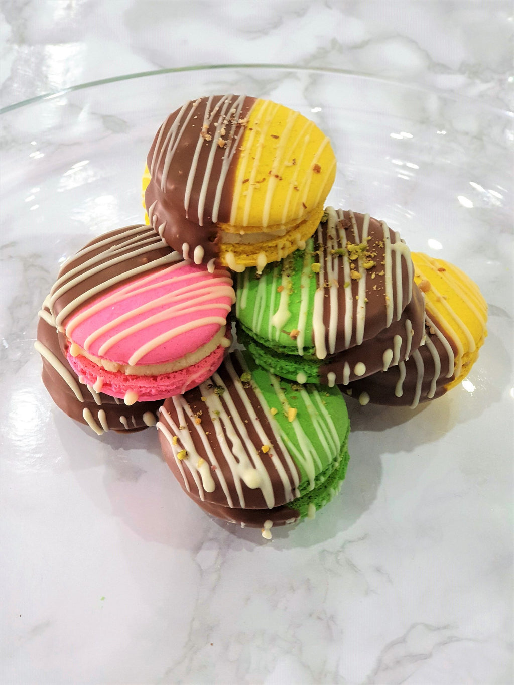 10 Chocolate Dipped Barfi Filled Macarons.