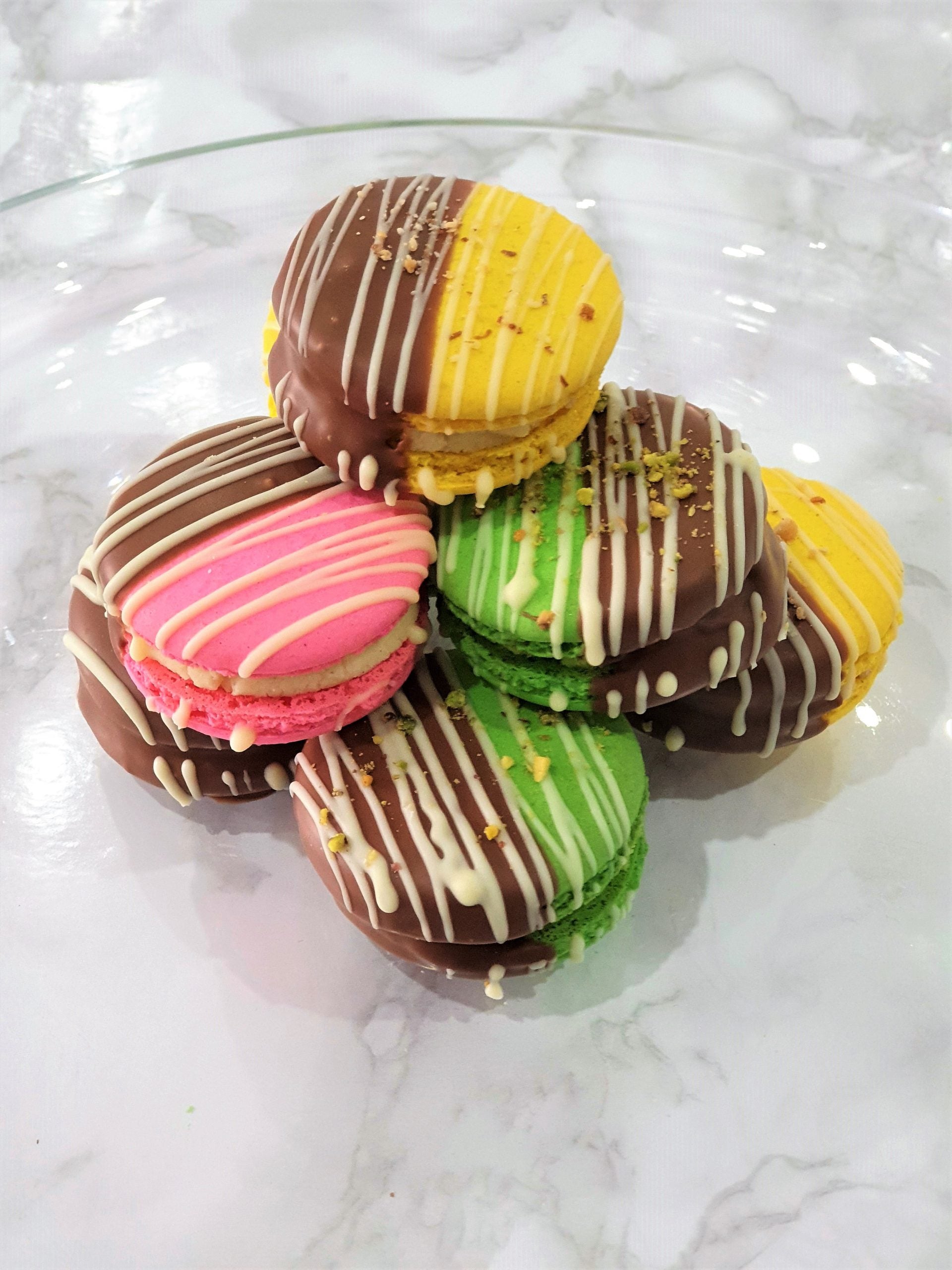 10 Chocolate Dipped Barfi Filled Macarons.